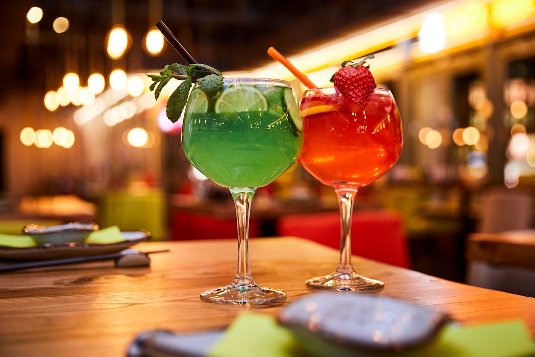 Colorful cocktail glasses arranged on table