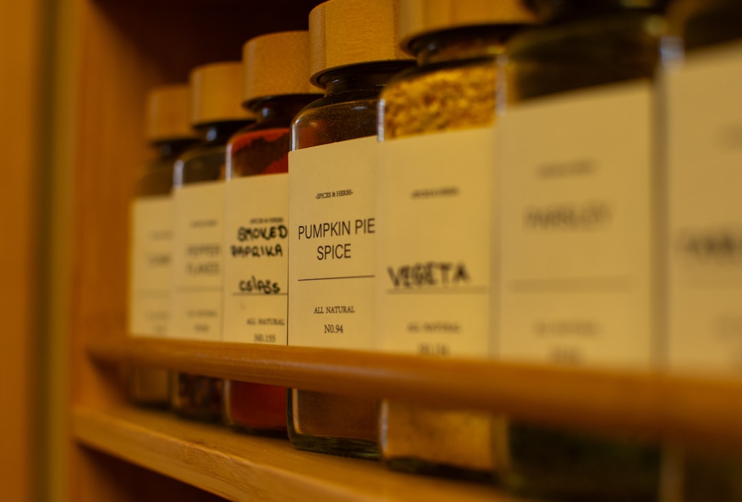 Wooden spice rack arranged neatly in kitchen