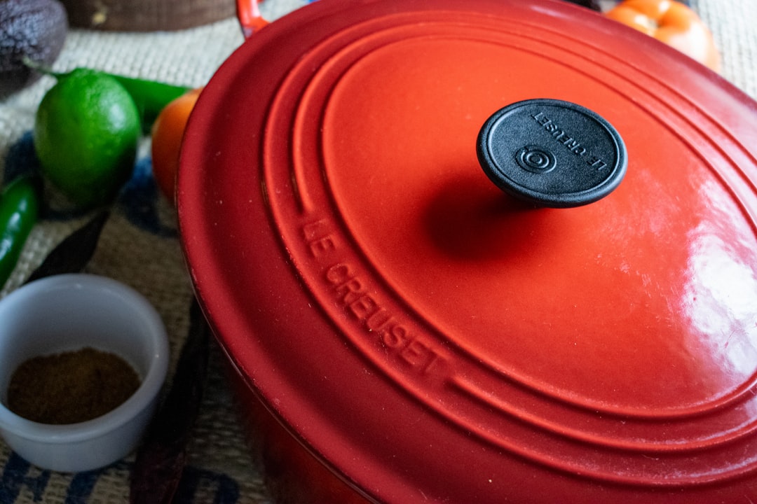 Tomato sauce simmering in a Dutch oven on the stove