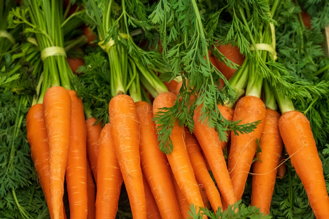 Fresh carrots and vegetables at farmers market ready for juicing