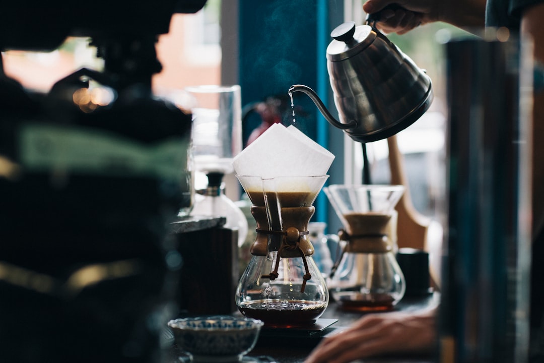 Pour over coffee brewing into a glass carafe