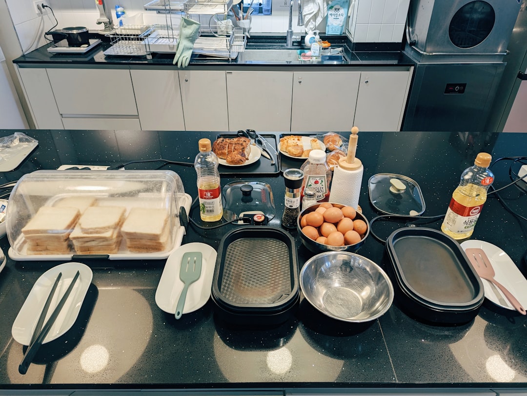 Kitchen counter set up for school lunch prep with containers and ingredients