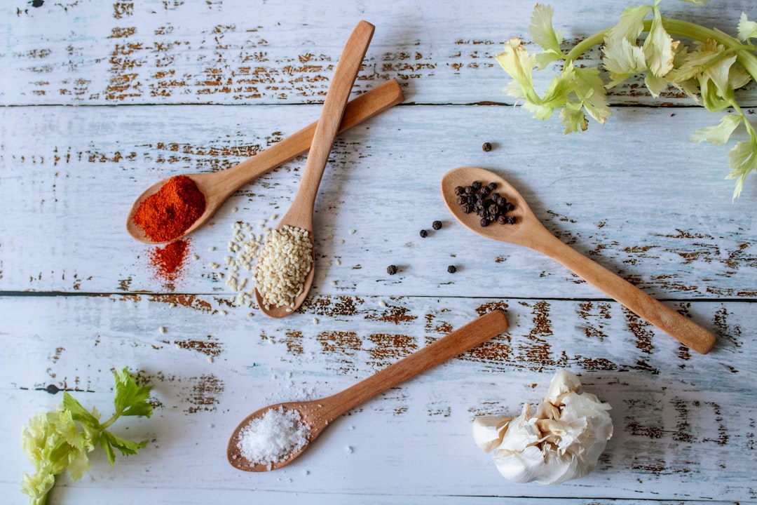 Kitchen herbs and wooden spoons on a countertop