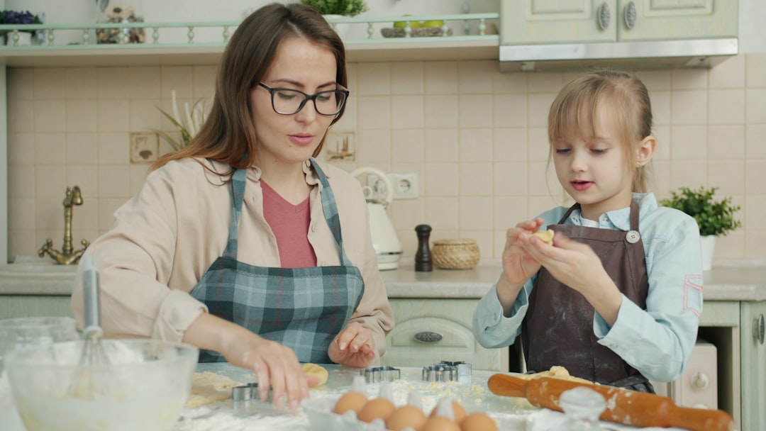 Freshly baked cookies with mixing bowl and dough