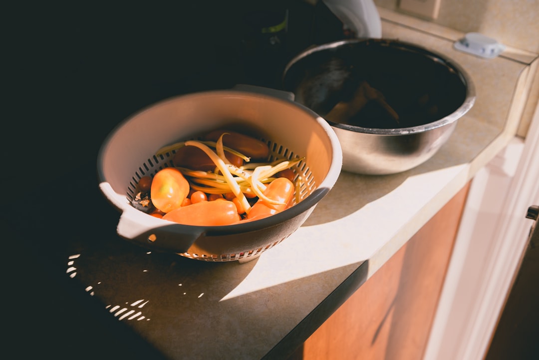 Assorted vegetable peels and scraps on a kitchen counter