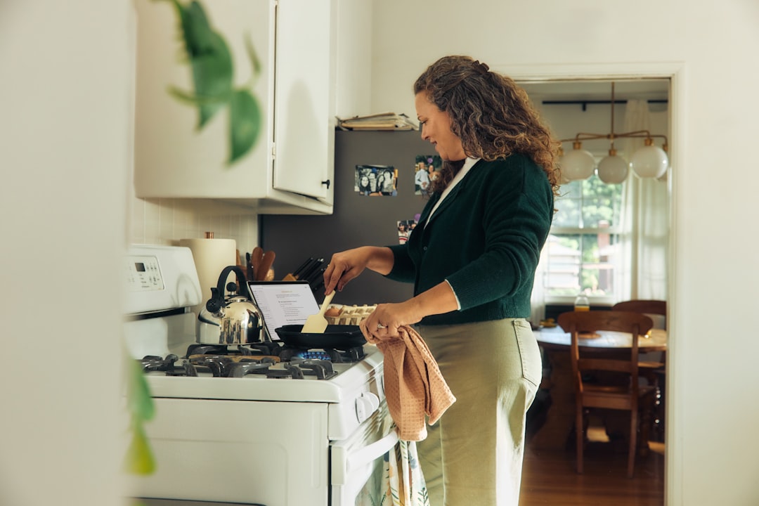 Woman cooking at home in kitchen