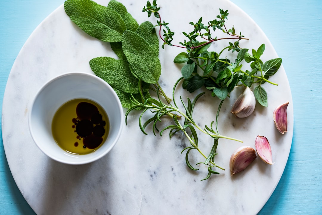 Fresh salad dressing in a jar with herbs