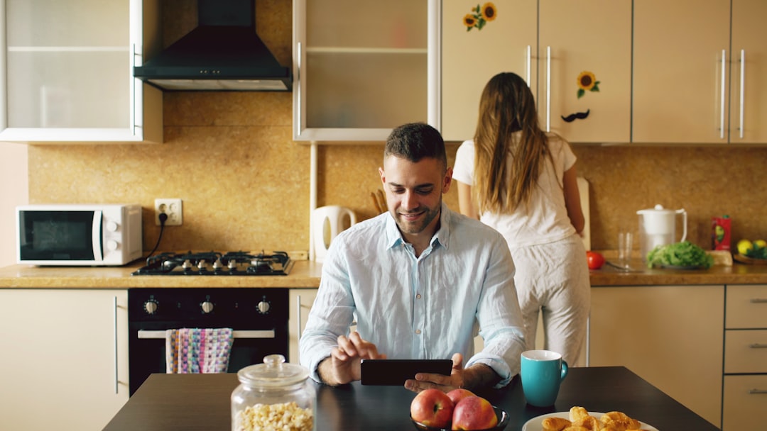 Woman using a tablet in a modern kitchen