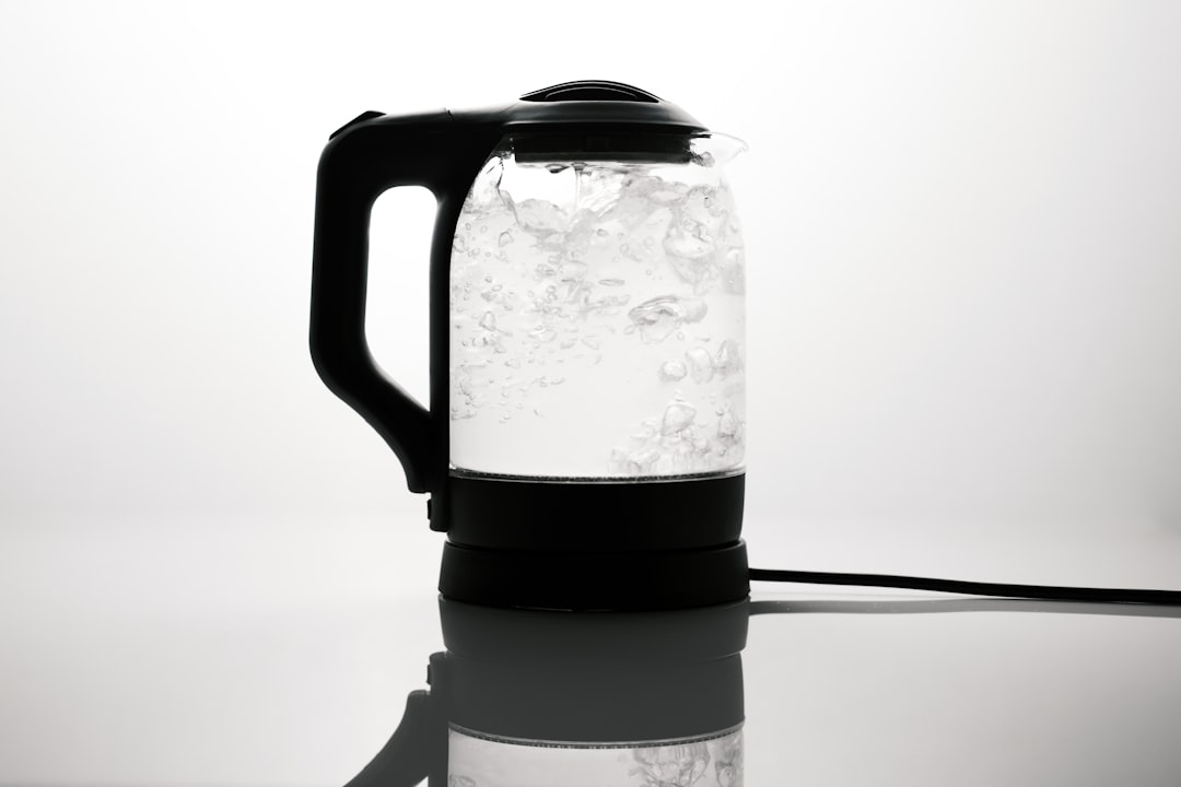 Electric kettle boiling water on a counter