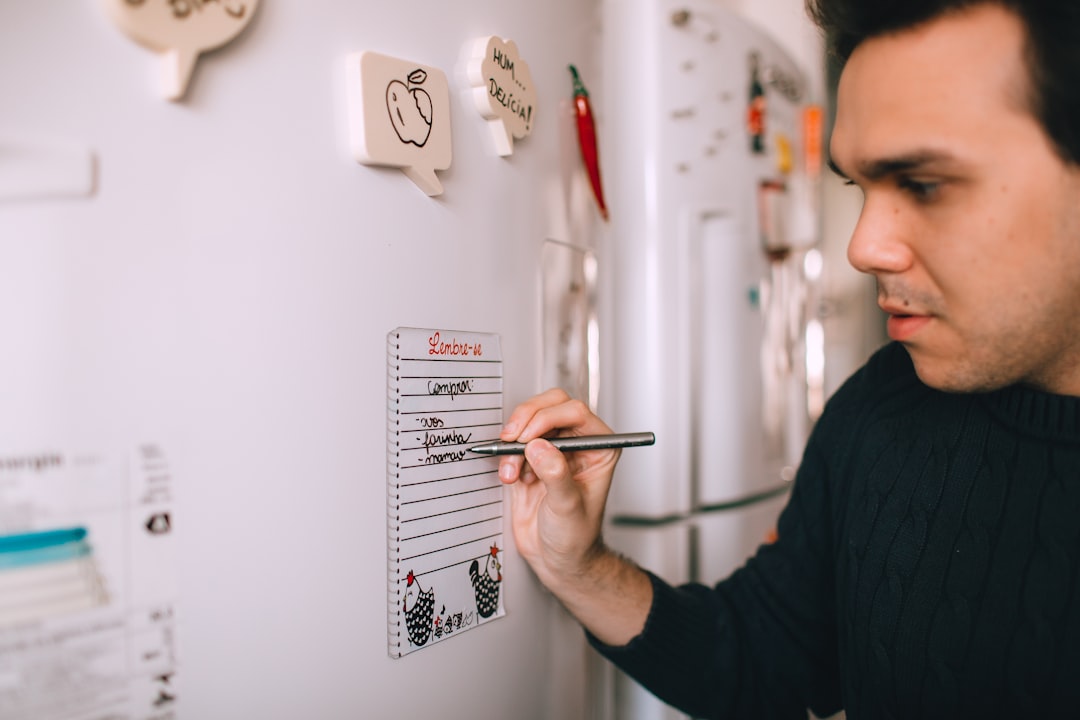 Weekly meal planner whiteboard on a refrigerator