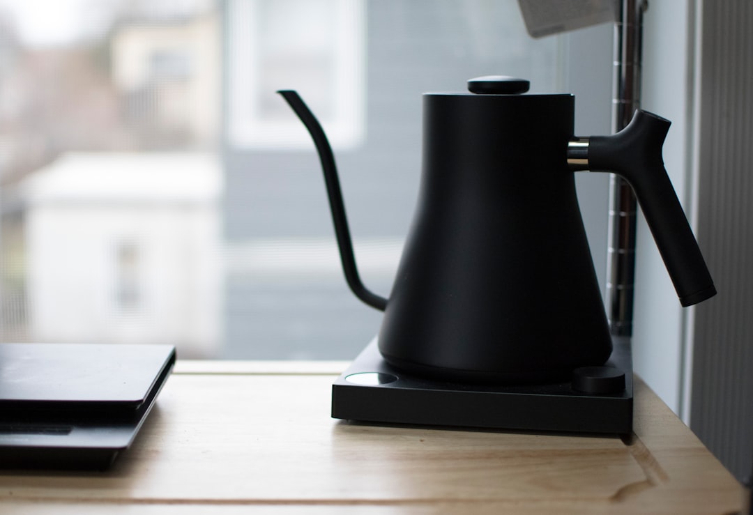 Gooseneck kettle pouring water in a spiral