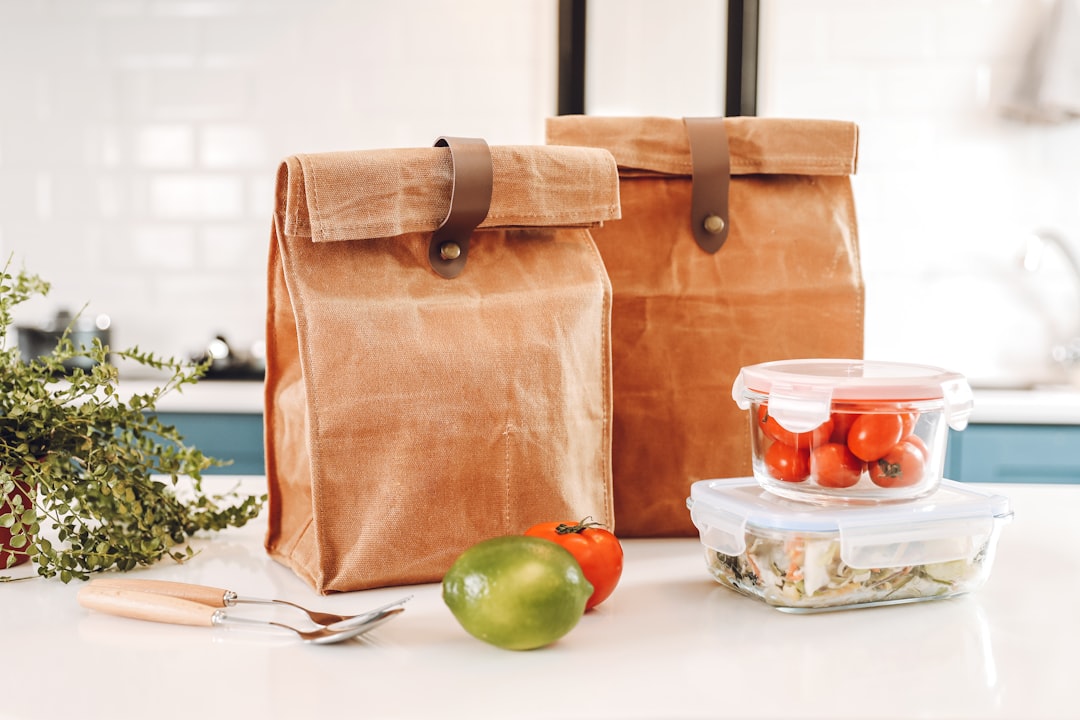 Insulated lunch bag packed with food containers