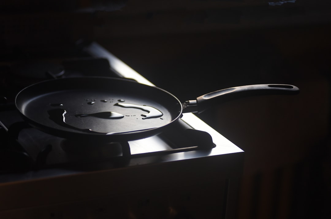 Deglazing a pan with liquid to create a sauce