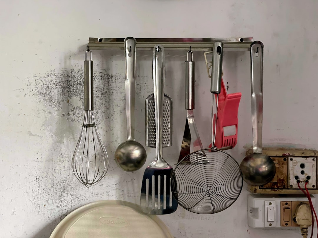 Kitchen cabinet door rack showing how vertical door space can be used for cutting board and lid storage
