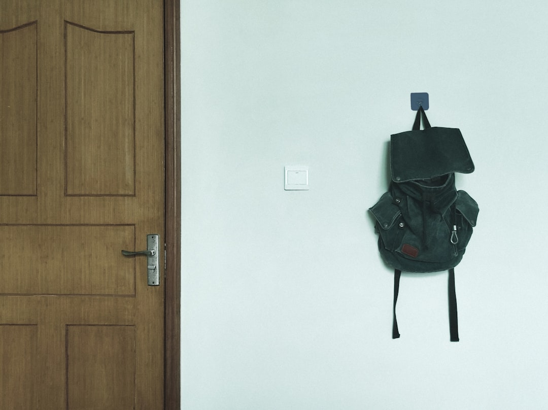 Over-cabinet-door storage hooks and baskets in use