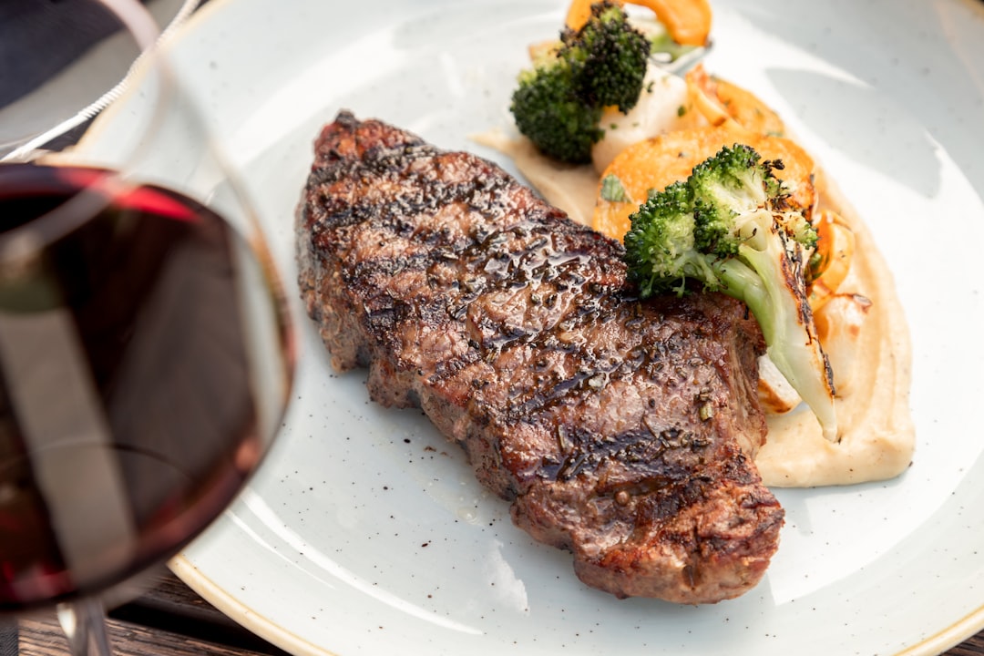 A beautifully plated steak dinner with a glossy pan sauce