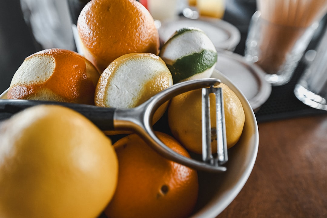 Citrus fruit and zesting tool for grating fragrant lemon zest