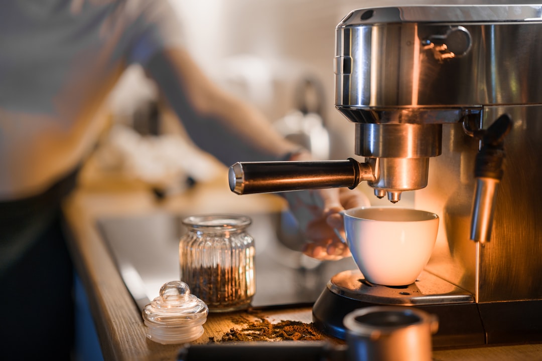 Single-serve coffee machine brewing a fresh cup in a home kitchen