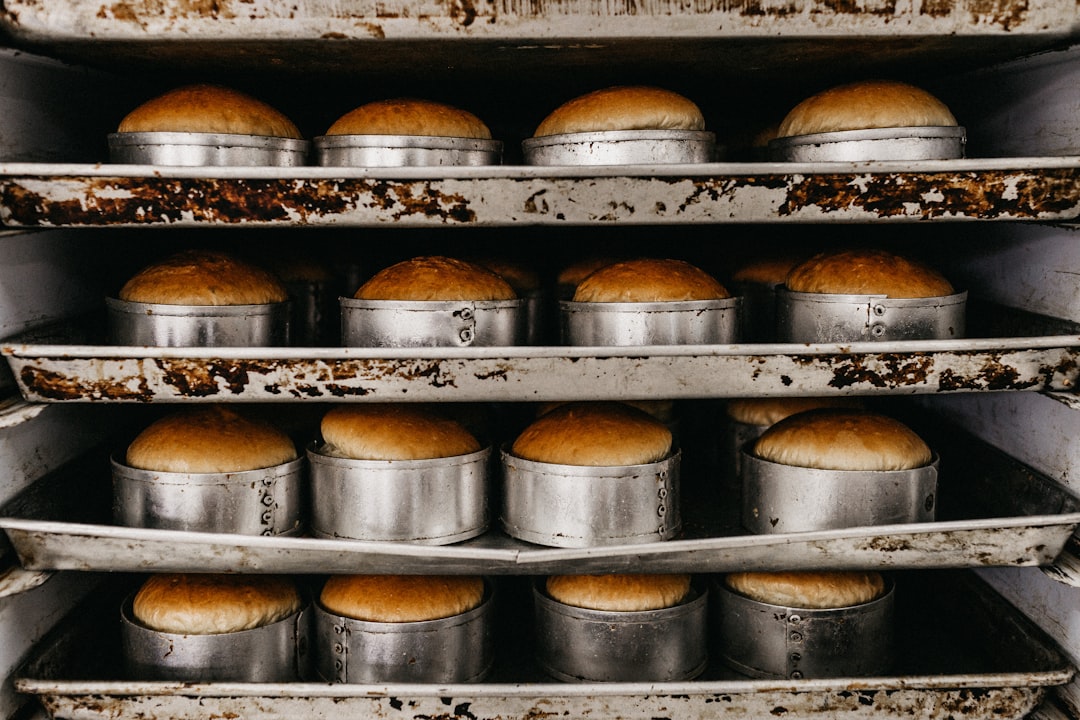 Stack of aluminum half sheet pans