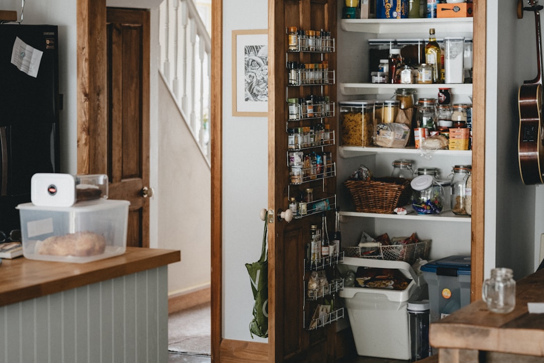 Over-the-door organizer holding pantry overflow items