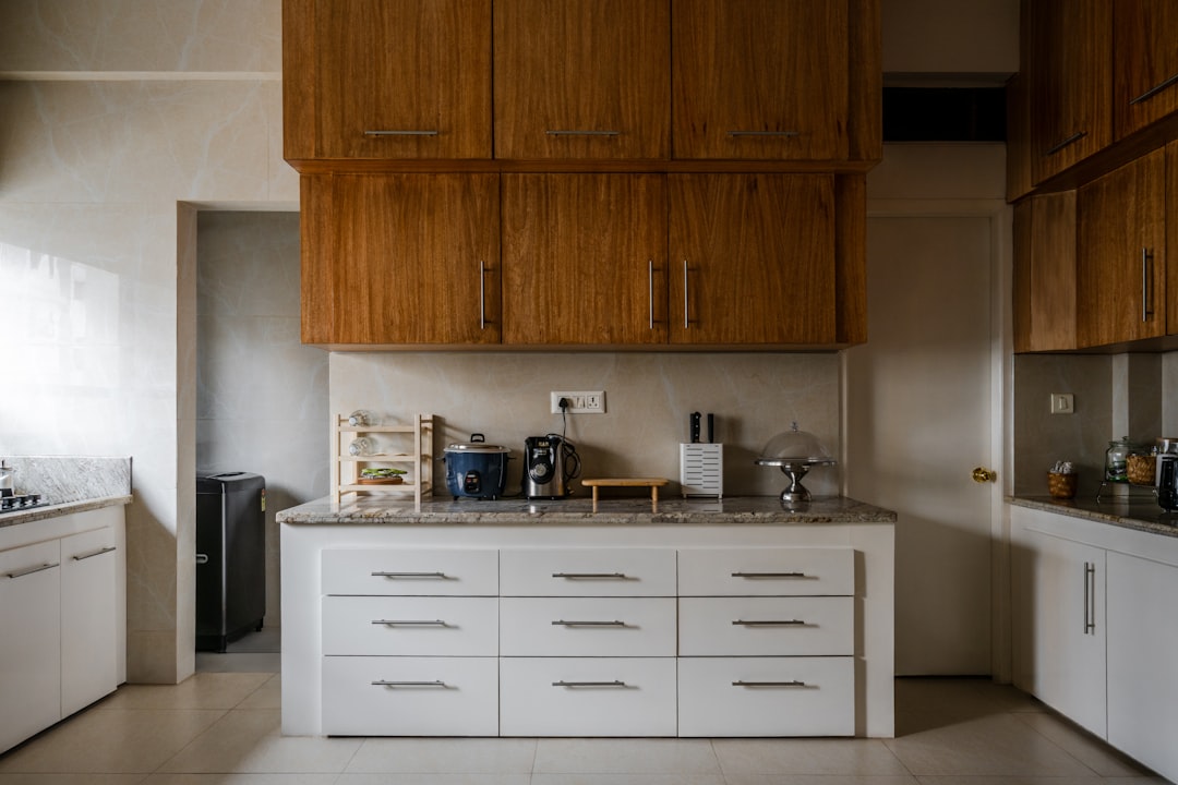 Clean organized kitchen cabinets with vertical storage solutions