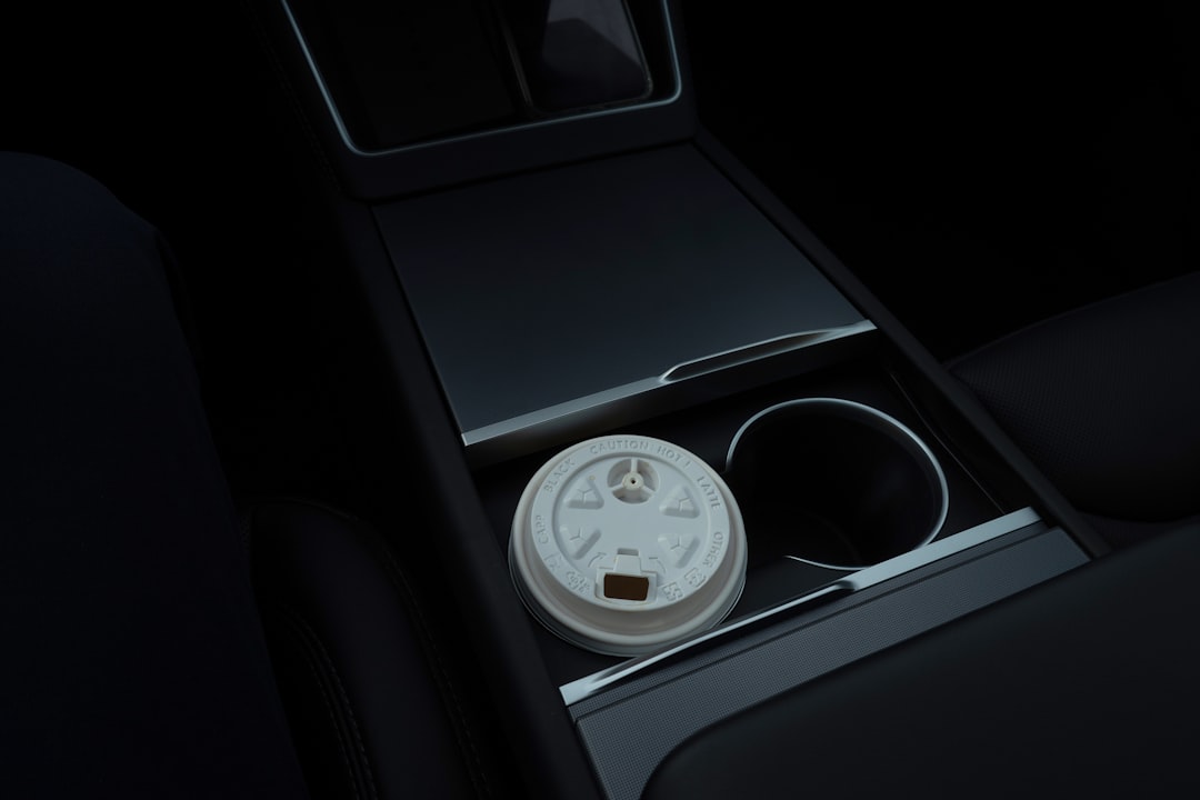 Water bottle fitting into a car cup holder