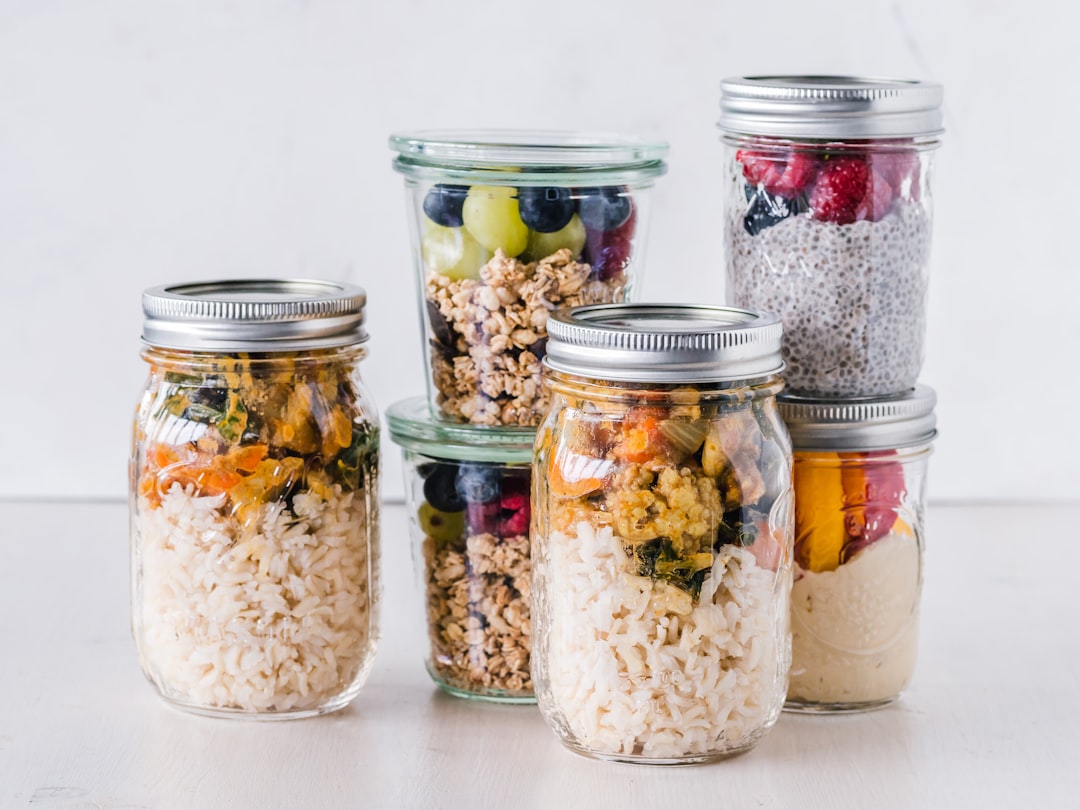 Mason jars filled with dried goods lined up in a pantry
