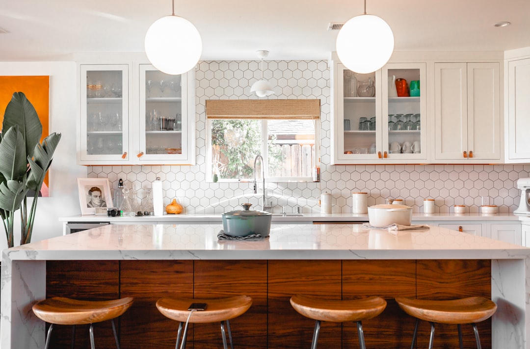 Clean modern kitchen with organized pantry showing accessible storage solutions