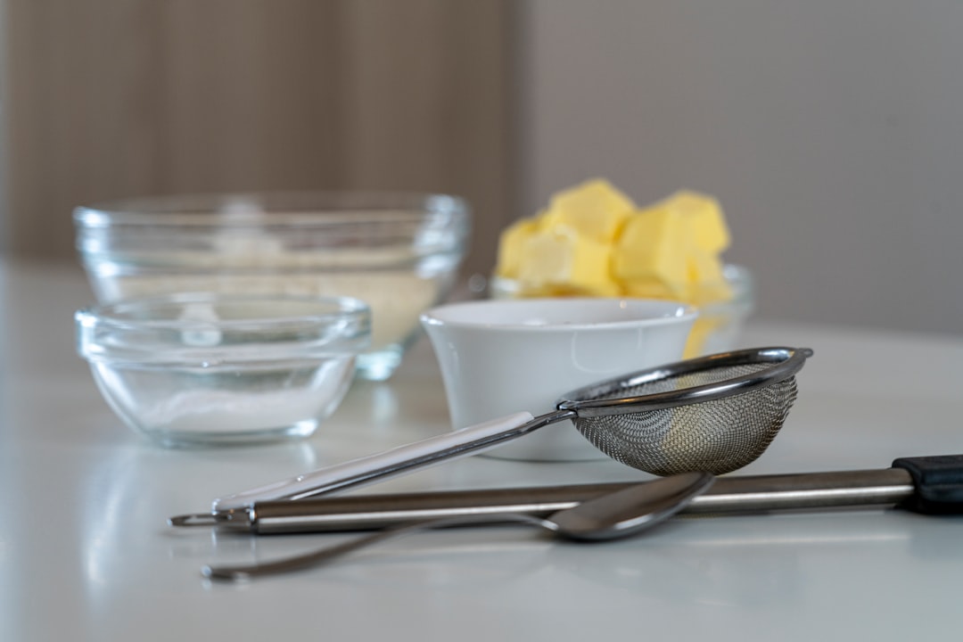 Stainless steel measuring cups arranged for baking