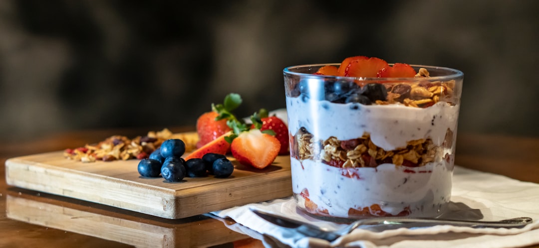 Yogurt parfait with berries and granola layered in a glass