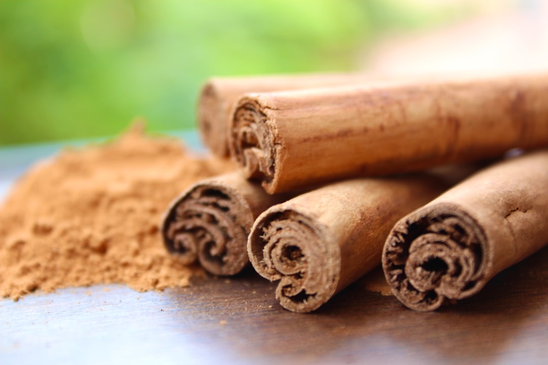 Cinnamon sticks and ground cinnamon on a wooden surface