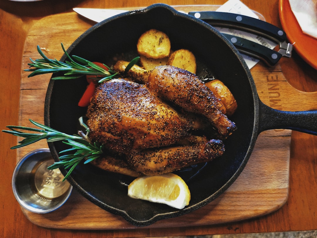 Spatchcocked chicken ready for roasting in a pan