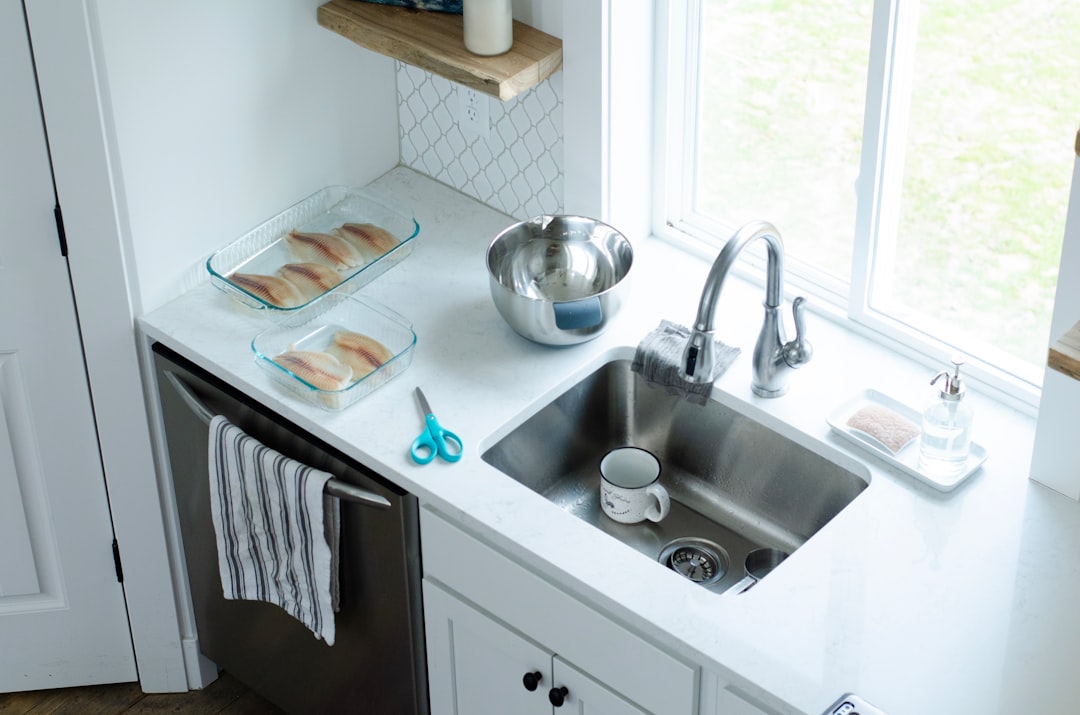 Washing pans at the kitchen sink