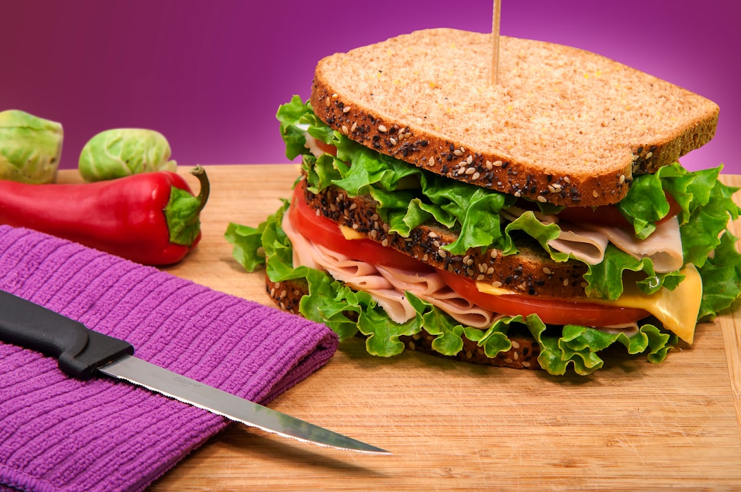 Sandwich on a wooden board ready to be packed into a school lunch