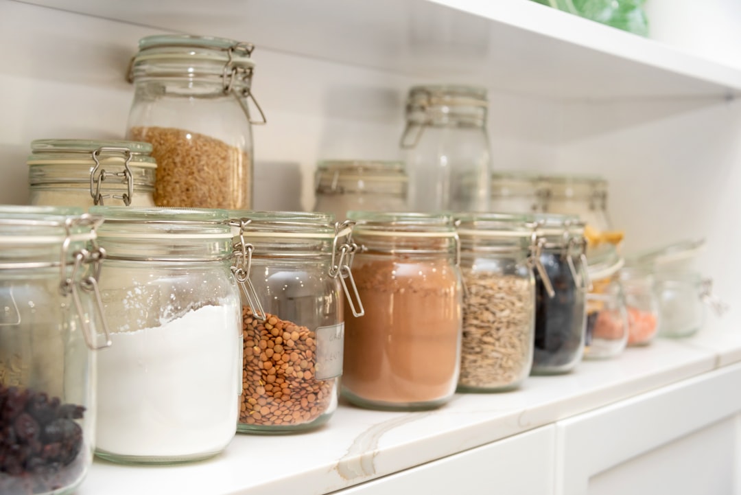 Shelf risers organizing pantry items in tiers