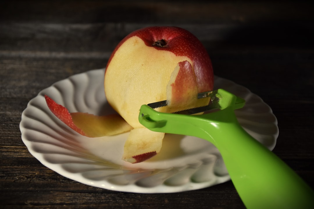 Peeling fresh apples in the kitchen