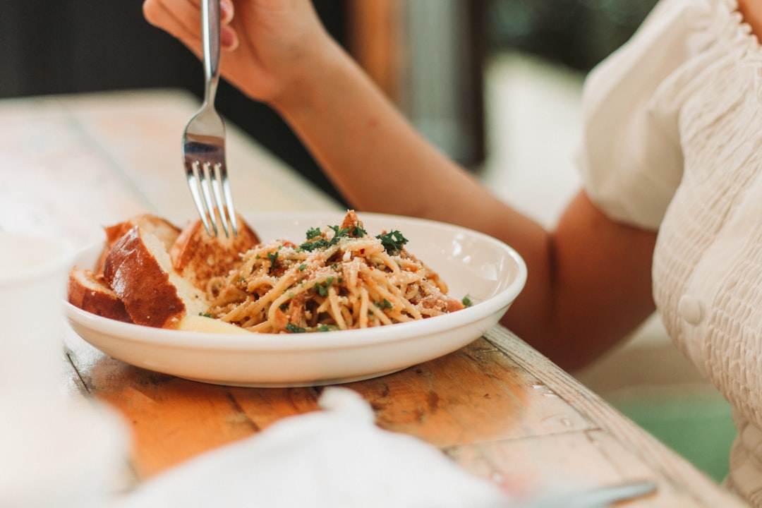 Fork twirling into a bowl of spaghetti