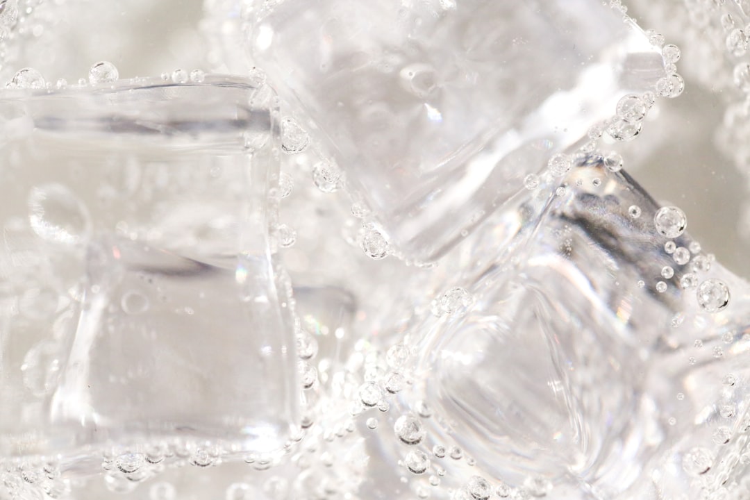 Ice cubes slowly melting in a glass of water