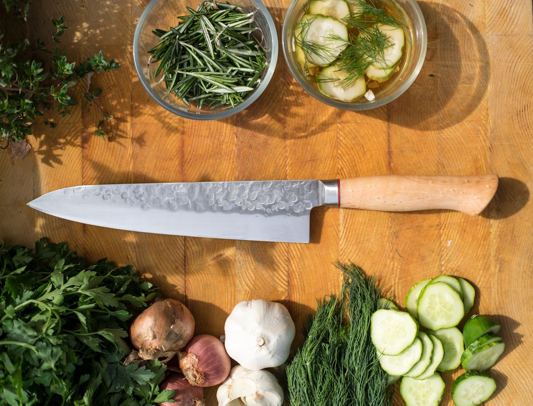 Kitchen tools including knives and shears arranged on a counter