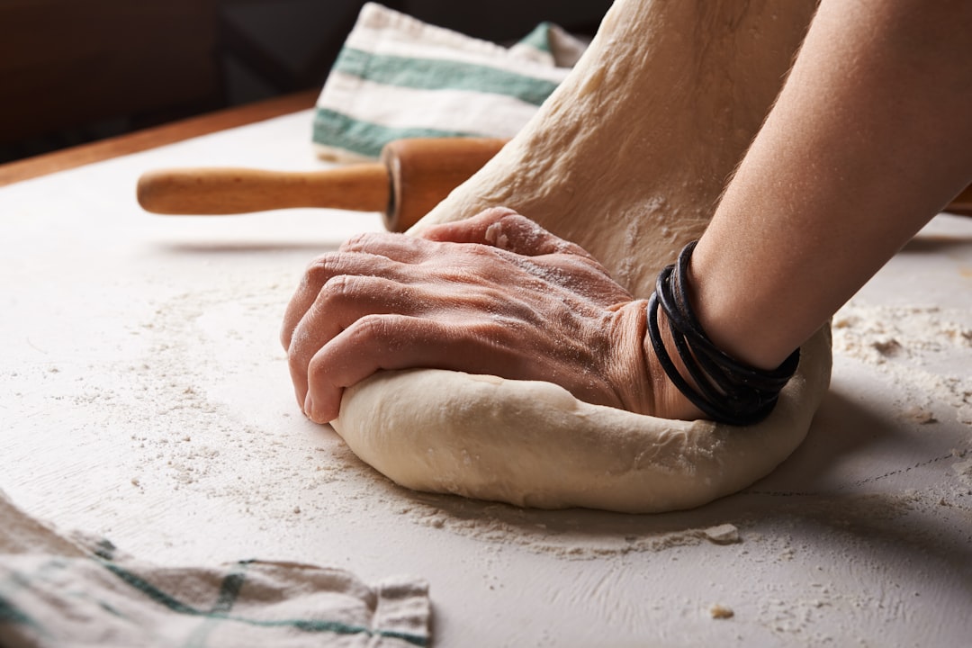 Pie dough being worked on a floured surface