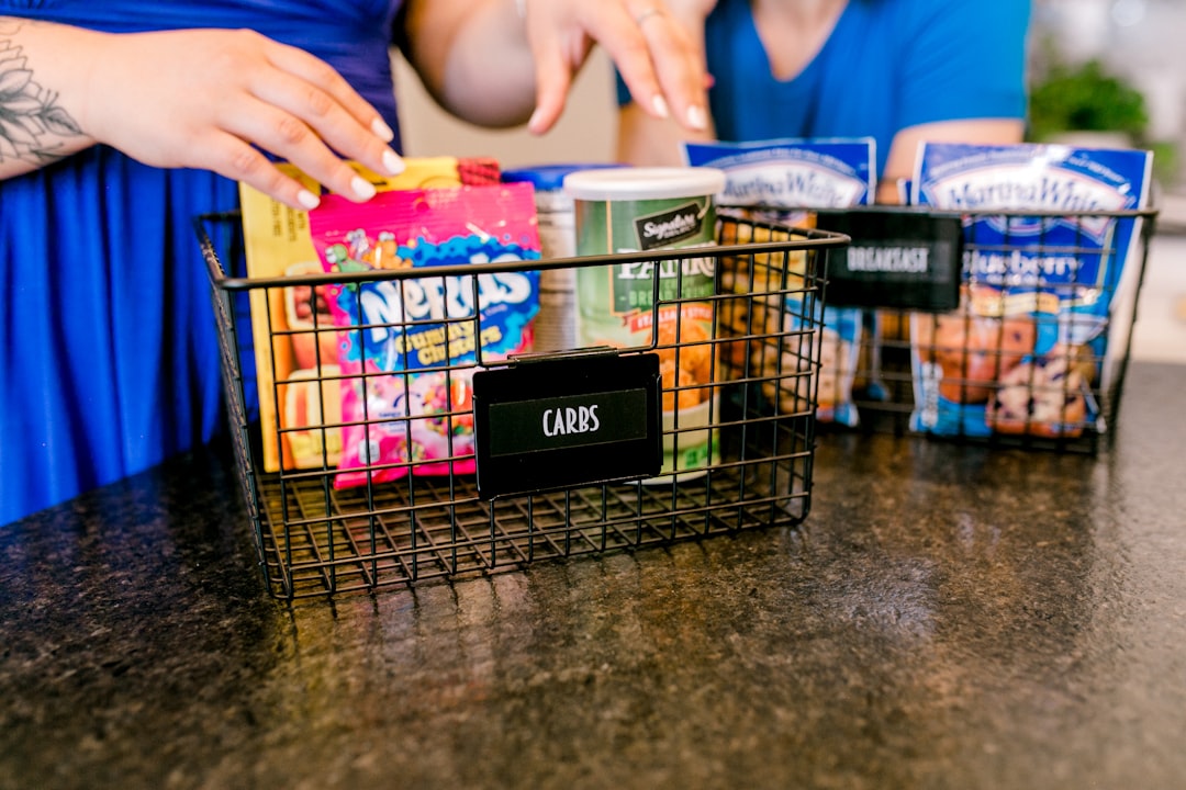 Wire under-shelf basket installed in kitchen cabinet