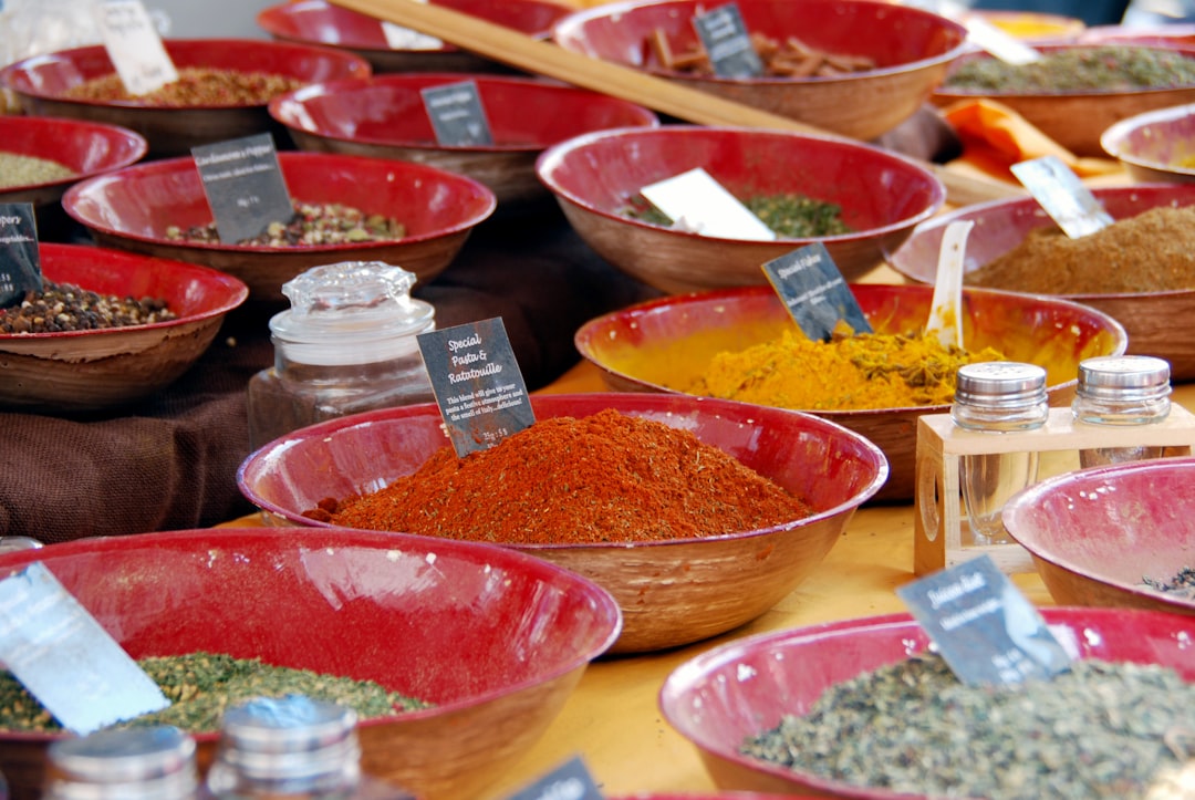An assortment of colorful ground spices in small bowls