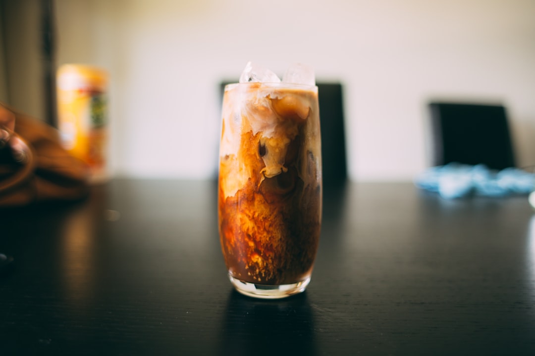 Iced coffee in a tumbler with condensation droplets