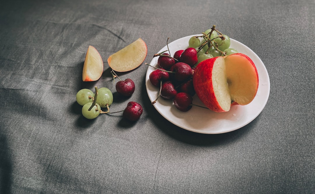 Apple slices and grapes ready for packing into school lunches