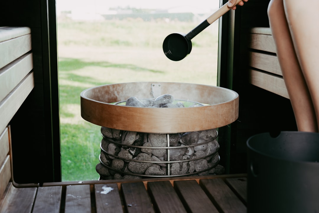 Ladle pouring soup into a bowl