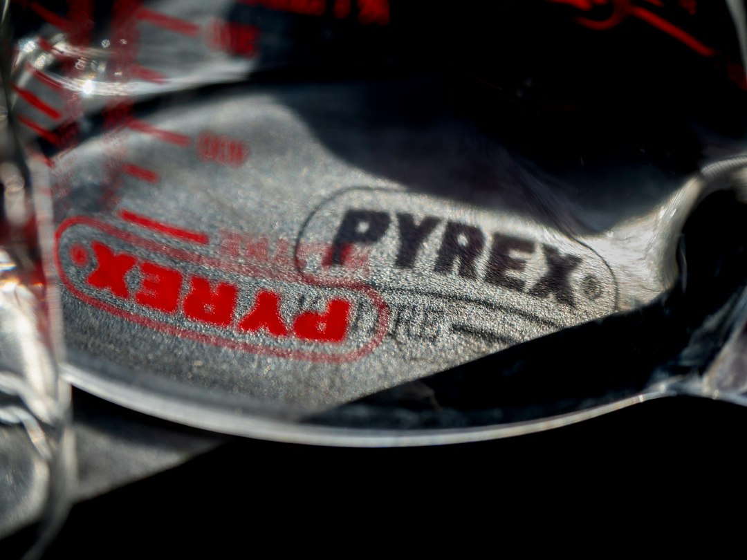 Close-up of a red Pyrex logo on vintage glassware
