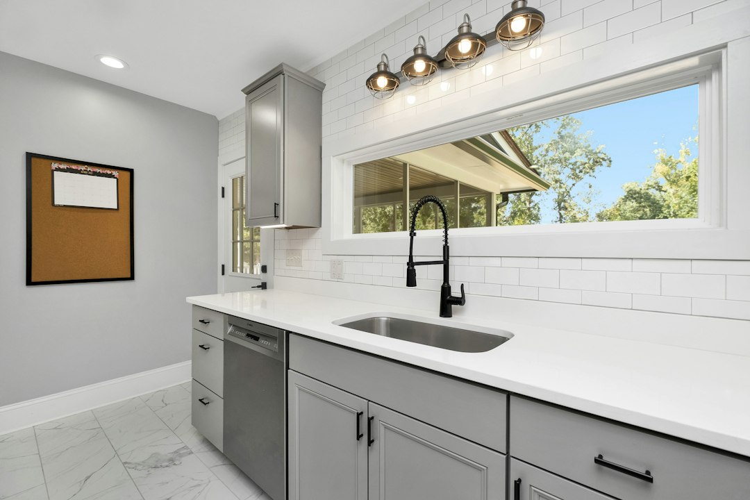 Clean kitchen counter and sink area after cooking