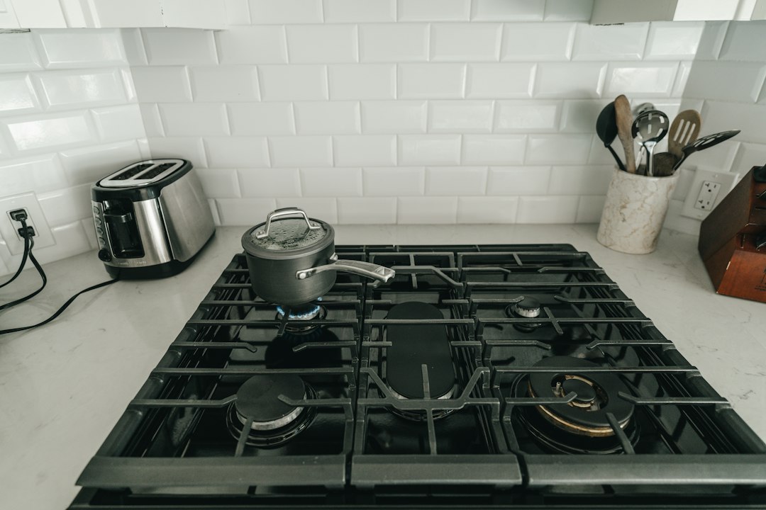 Stovetop moka pot brewing on a kitchen stove