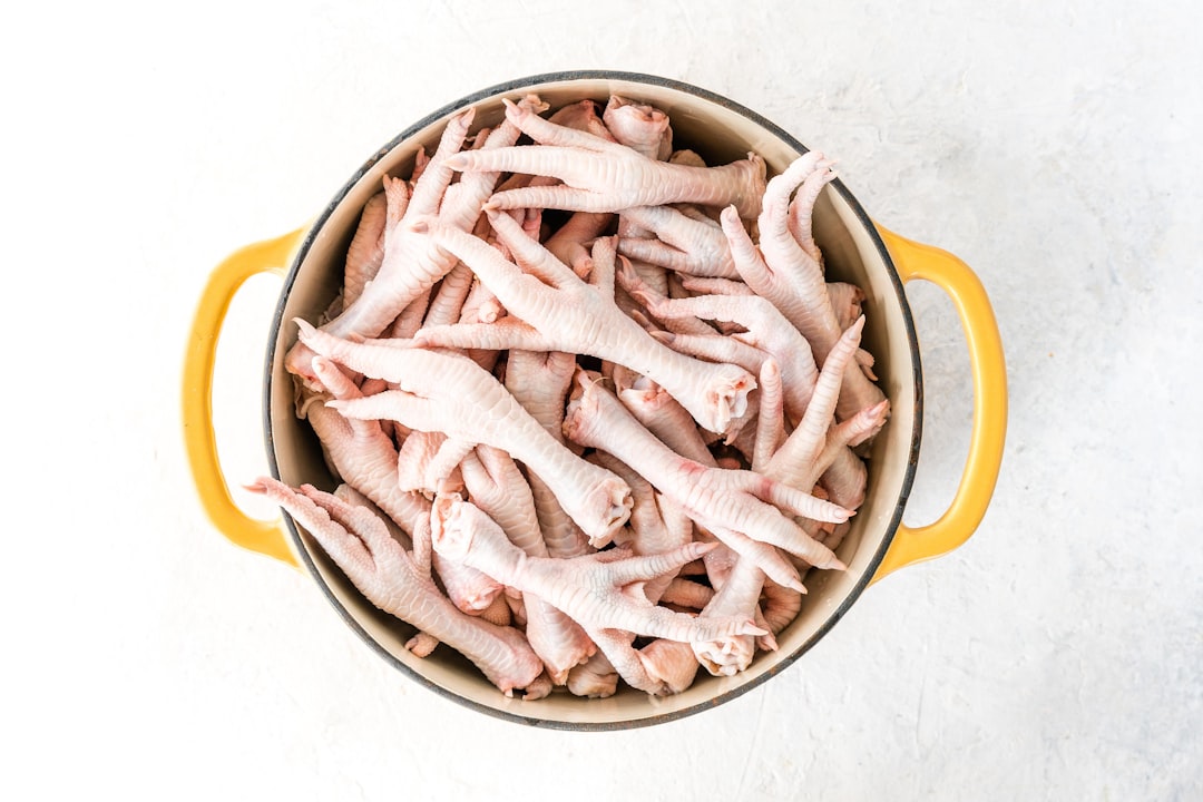 Chicken bones and vegetables simmering in a pot for stock