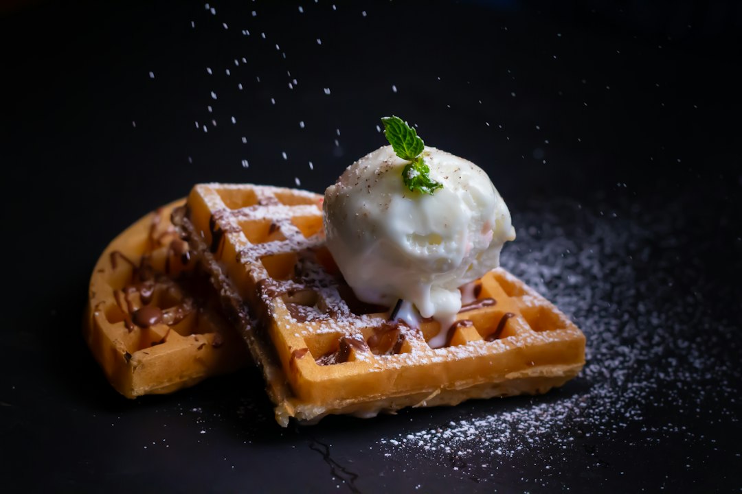 Belgian waffle topped with chocolate and berries